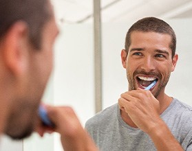 a man brushing his teeth