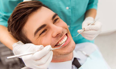 Smiling man in dental chair