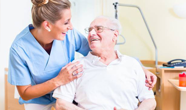 Smiling senior man in dental chair