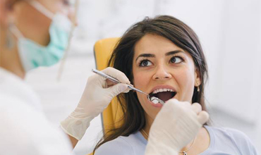 Woman receiving dental treatment