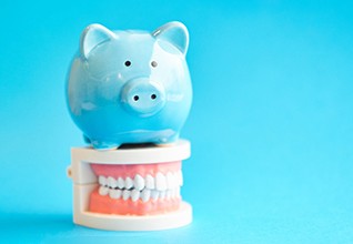  A blue piggy bank sitting on a jaw mockup