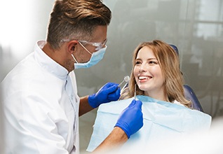 young woman talking to her dentist