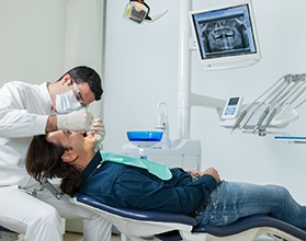 dentist examining a patient’s mouth