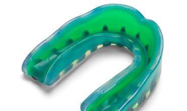 Close-up of a green athletic mouthguard