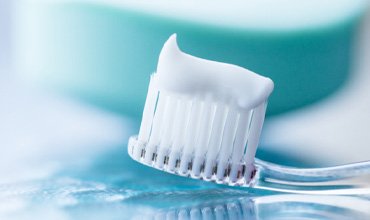 Close-up of a toothbrush with some toothpaste