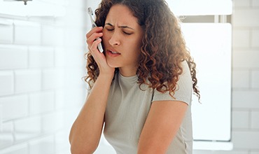 Patient experiencing sensitivity while brushing teeth