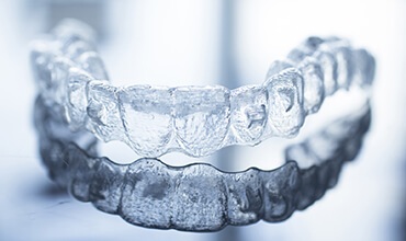 Invisalign tray resting on tabletop