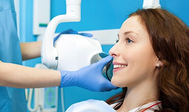 Female patient receiving digital x-ray