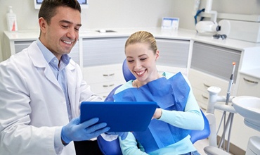 Cosmetic dentist in Chevy Chase smiling with patient