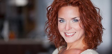 red headed woman smiling