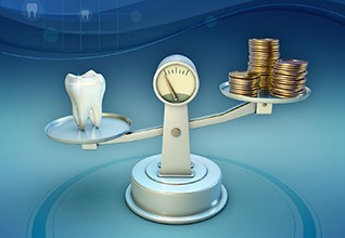 Tooth and coins on a balance scale