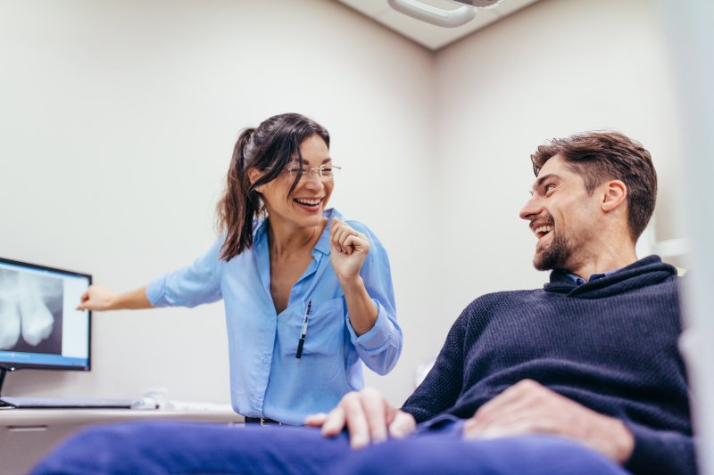 man talking with dentist in Chevy Chase